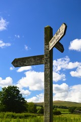 Wooden signpost in the Yorkshire countryside.