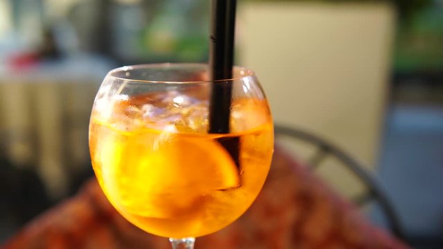 Iced spritz cocktail on a hot day, 4K