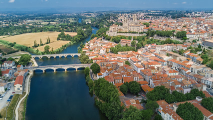 Fototapeta na wymiar Aerial top view of Beziers town, river and bridges from above, South France 