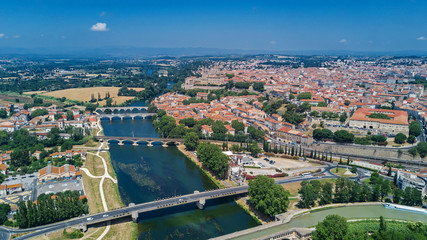 Fototapeta na wymiar Aerial top view of Beziers town, river and bridges from above, South France 