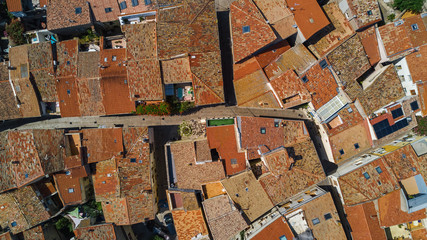 Aerial top view of residential area roofs from above, medieval town background
