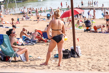 Sierakow, Poland on July 20, 2017. Holidaymakers enjoying summer holidays at the Lake Jaroszewskie beach. 