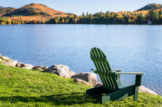 Adirondack Chair on the Shore of a Lake on an Autumn Morning