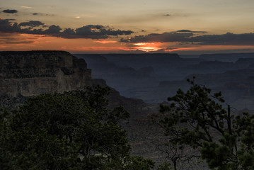 Sun setting at south rim of the Grand Canyon in Arizona