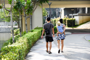 Fototapeta na wymiar Asian family walking in the park