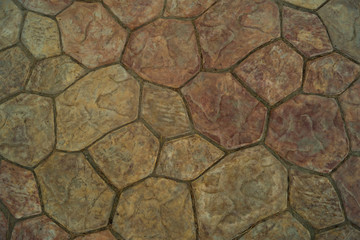 Brown and beige cobbles different sizes, background, texture