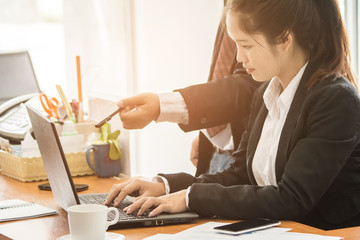 Business team discussing the charts and graphs at meeting present on office desk.