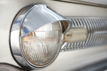 Old car head lights closeup