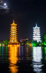 Foto op Canvas Two towers in Guilin in China with moonlight sky © creativefamily
