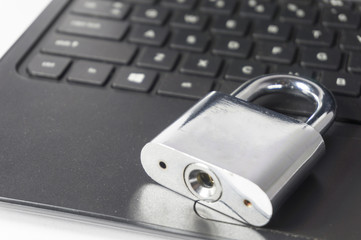 silver Padlock on top of notebook
