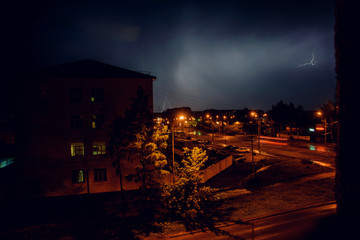 Thunderstorm with lightning over the houses at residential area at Moscow suburb