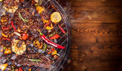 Barbecue grill with beef steaks, close-up.