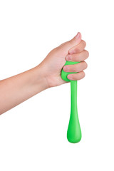 A drop of green mucus in the hands of a child. Toy mucus for children
