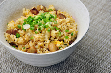 Close-up fried rice with garlic and deep fried pork in bowl Japanese style
