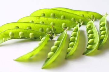 Green peas in pods closeup