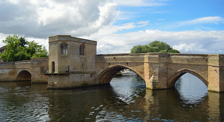Fototapeta na wymiar The Historic Parkhorse Bridge at St Ives Cambridgeshire with Chapel