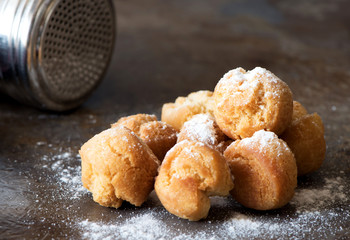 Homemade small donuts with powdered sugar