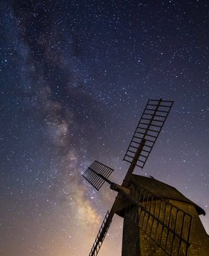 Milky Way rising over windmill