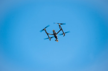 Drone in sky/Dron-quadrocopter soars in sky