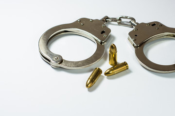 handcuffs and bullets