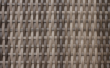 Wooden grid, the background of woven wood. Gray interlacing of wooden sticks.