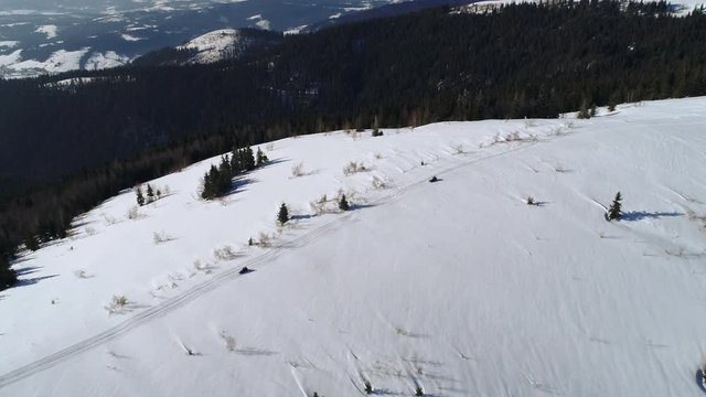 Aerial - Ski lift at ski resort in sunny Carpatian mountains