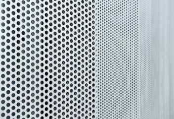 Gray metal background, round perforated metal texture