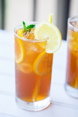 Iced Tea With Lemon Slices and Mint in Glass on a Hot Summer Day