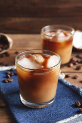 Glasses of cold tasty coconut coffee on table
