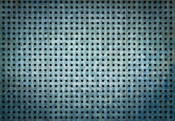 Metal background with perforation of square holes. Blue steel texture.