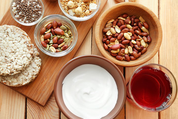 Tasty breakfast with yogurt on table