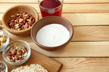 Tasty breakfast with yogurt on table