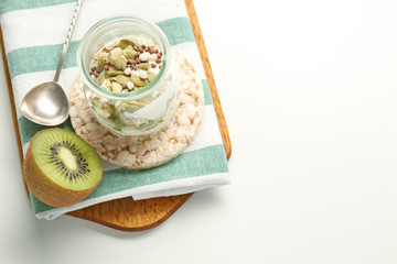 Tasty breakfast with yogurt on white background