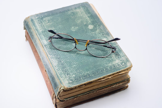 Bifocal reading glasses on vintage book