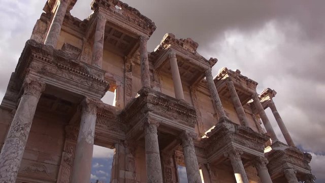 Celsus Library in Ephesus (Efes) - ancient Greek city on the time lapse cloudy sky,  Izmir, Turkey