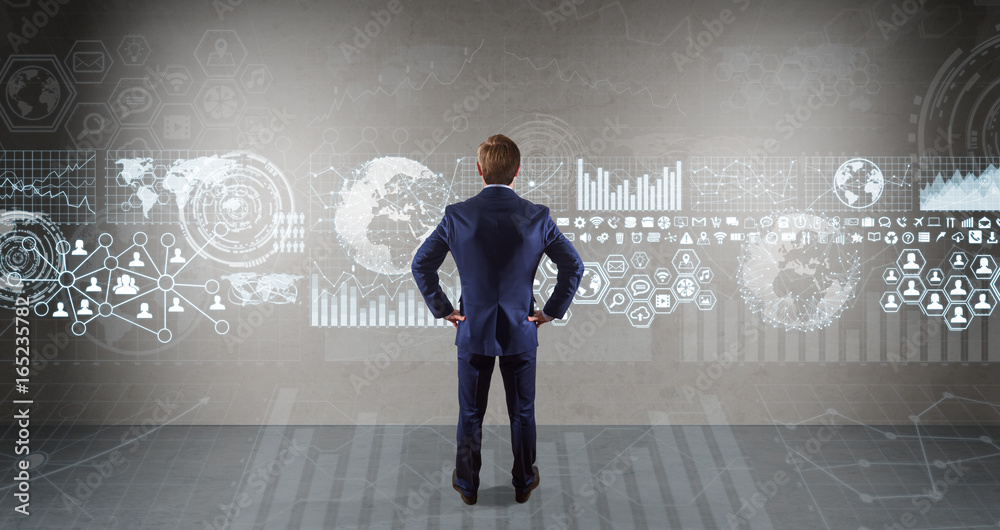 Poster Businessman using graph screens interface on a wall 3D rendering