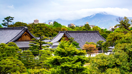 Fototapeta na wymiar Juxtaposition of New and Old Buildings in Kyoto, Japan