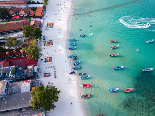 Aerial view from the drone on the taxi boats at the azure sand beach of Thailand,koh Phangan island