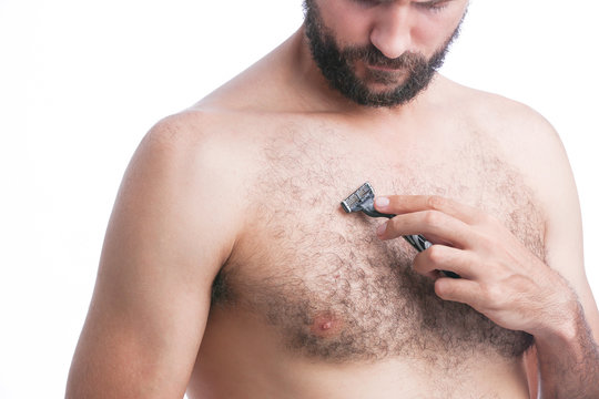 Man Shaving His Chest With Razor