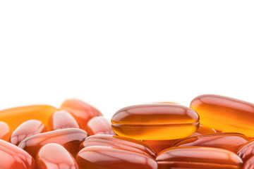 top view of gel pills with plastic bottle on white background