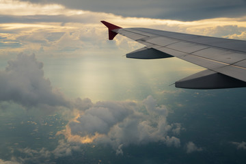 Fototapeta premium view of sunlight shine ray and airplane wing