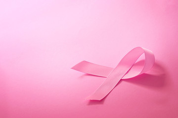 The Sweet pink ribbon shape on pink background paper for Breast Cancer Awareness symbol to promote ...