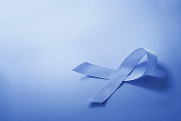 the Blue color tone of ribbon as symbol for cancer awareness with copy space