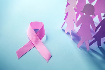 Sweet pink ribbon shape with the girl paper doll on blue background  for Breast Cancer Awareness symbol to promote  in october month campaign