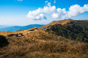 mountain landscape brown grass , road to Sandakphu at Sikkim, India