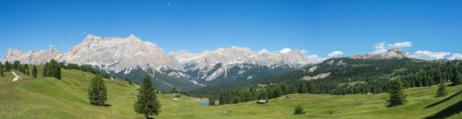 Fototapeta na wymiar Fantastic landscape on the Dolomites. View on the peaks called Sas Crusc, Lavarela, Conturines and Pizes de Fanis. Place is Alta Badia, Sud Tirol, Italy