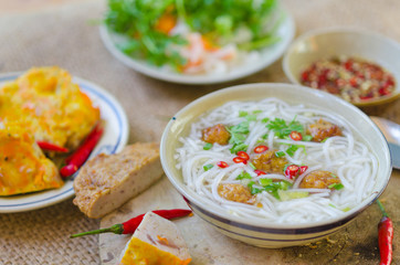 Banh Canh - one of most popular soup noodle in the seaside area with rice noodle, grilled fish, green onion and fish sauce...