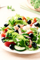 Salad with prosciutto crudo and black olives