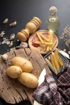 Deep Fried Potato Slice and Potato on wooden baord for cooking