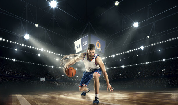 one basketball player with ball on stadium. basketboll freestyle effect.